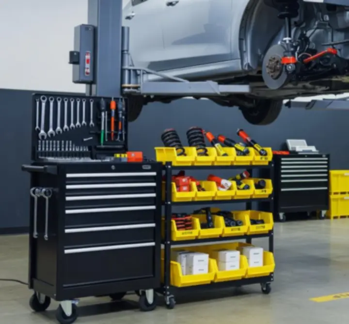 Technicians using advanced diagnostic equipment in an automotive workshop
